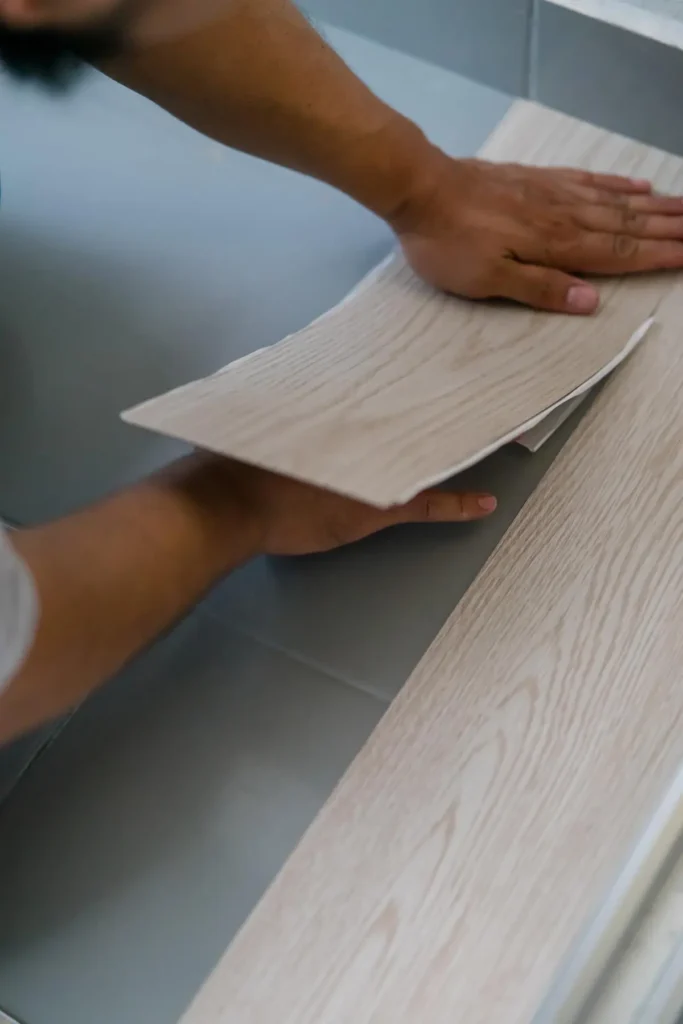 Masterful hands carefully installing high-quality flooring. Skilled Master Build & Design flooring professionals ensure a precise and flawless installation - Flooring installation in NJ